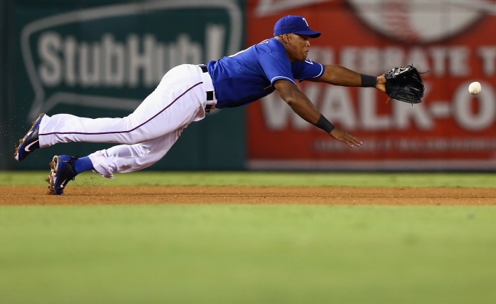 ARLINGTON, TX - SEPTEMBER 10:  Texas Rangers third baseman Adrian Beltre #29 dives for a ground ball hit by Pittsburgh Pirates right fielder Marlon Byrd #2 in the top of the fifth innin at Rangers Ballpark in Arlington on September 10, 2013 in Arlington, Texas.  (Photo by Tom Pennington/Getty Images)